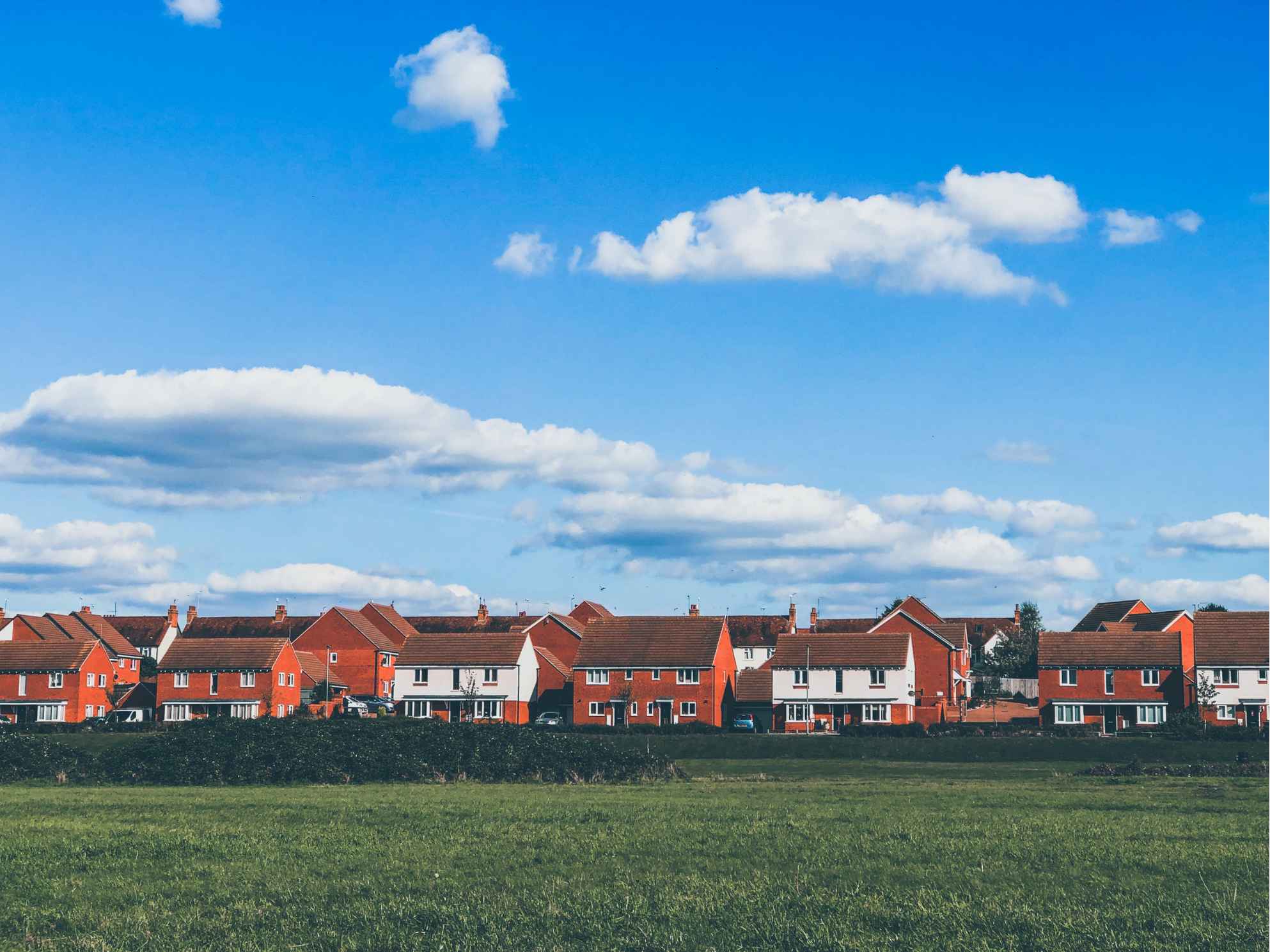 A housing estate across an open field