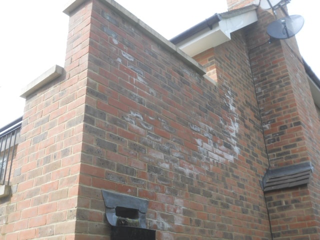 Penetrating damp walls on exterior brickwork of house