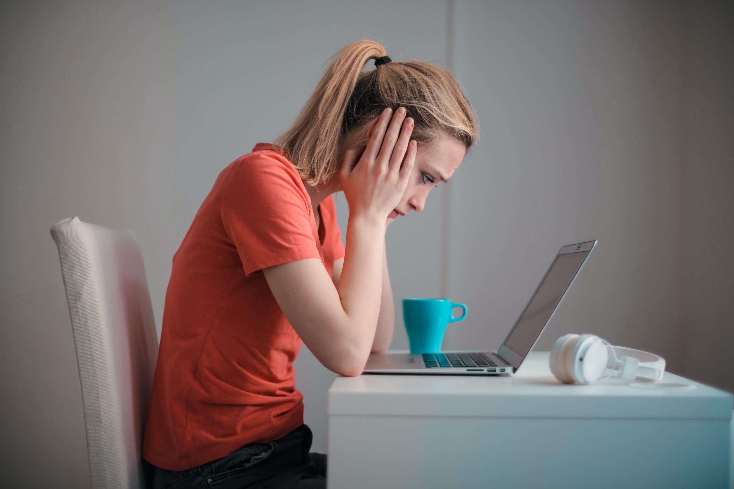 woman looks at laptop screen issues with home survey